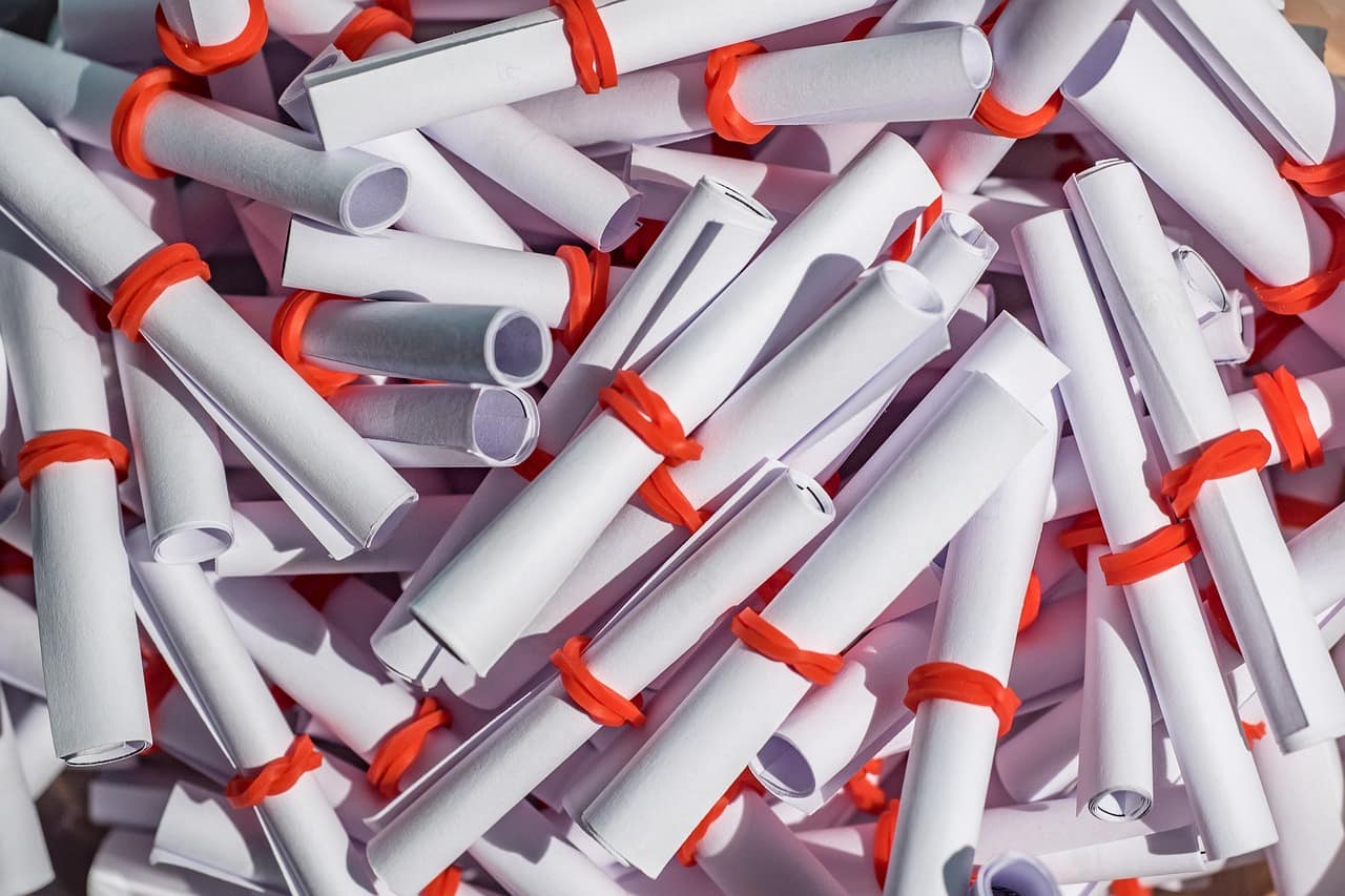 A pile of rolled paper slips ready for a draw, like the horses pulled out of the hat in a Grand National sweepstake